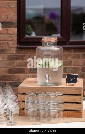 Glass jars of lemonade on party bar. Drinks on wedding party. Outside catering drinks service. Business, catering service. Drinks on summer party. Cat Stock Photo