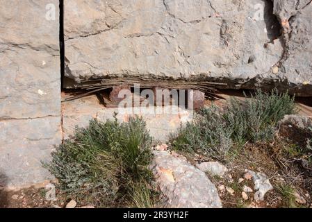 Abandoned Marble Quarry with Rusty Metal Wedges & Cut Marble Block or Rock with Wire Saw Marks on Montagne Sainte-Victoire Mountain Provence France Stock Photo