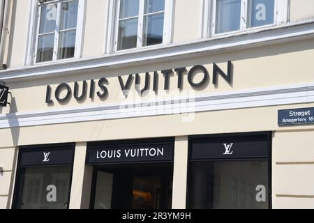 25 May 2023/ Consumers wait at Louis Vuitton store in danish capital  Copenhagen on stroeget pedestrain stree. (Photo.Francis Joseph Dean/Dean  Pictures Stock Photo - Alamy