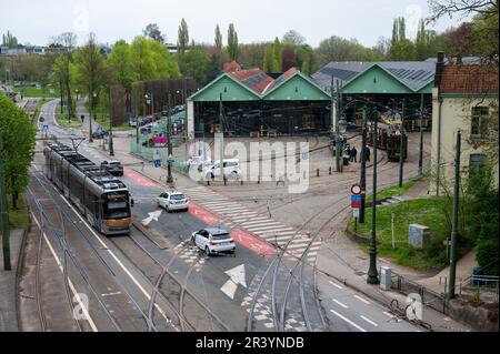 Auderghem, Brussels Capital Region, Belgium - April 29, 2023 - Cars and a tramway passing at the tram museum at the Avenue de Tervuren Stock Photo