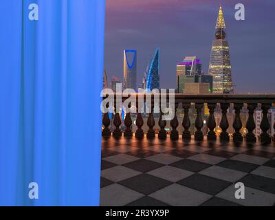 A view of Riyadh city, Saudi Arabia from a terrace (balcony) of a high building from inside the room showing a white beautiful curtains. Stock Photo