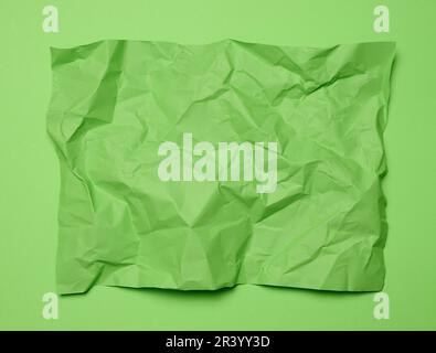 Rectangle Paper Top View Crumpled rectangular sheet of green paper on a green background, top ...