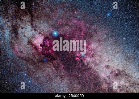 Star clouds and red emission nebulae in central Cygnus. Stock Photo