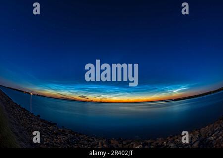 Fish-eye view of noctilucent clouds over Crawling Valley Reservoir in southern Alberta, Canada. Stock Photo