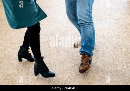 View of legs and feet of man and woman dancing Stock Photo