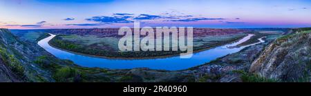 Twilight panorama over the curve of the Red Deer River, Alberta, Canada, overlooking the Horsethief Canyon. Stock Photo