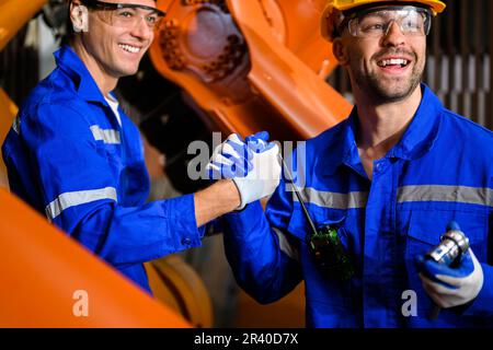 Maintenance engineers team working together at industrial factory Stock Photo