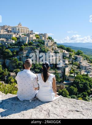 Couple on vacation in Southern france looking out over the old historical village of Gordes Luberon Stock Photo