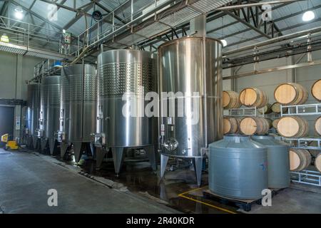 Stainless steel fermentation vats & wine barrels at the Ferrer Winery in Gualtallary, Tupungato, Valle de Uco,  Argentina. Stock Photo