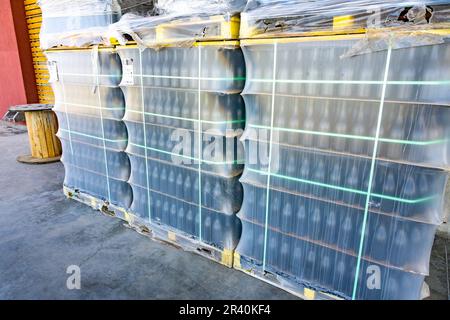 Pallets of stacked new wine bottles ready for filling at the Ferrer Winery in Gualtallary, Tupungato, Valle de Uco,  Argentina. Stock Photo