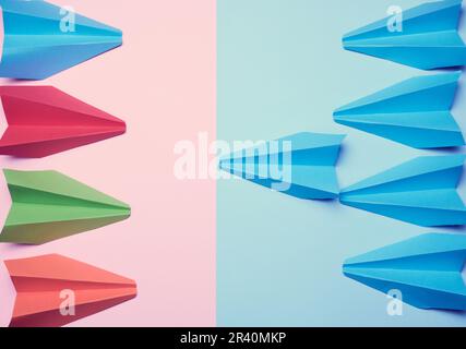Two groups of paper boats facing each other, a concept of confrontation Stock Photo