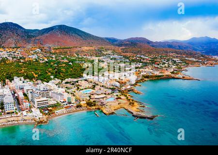 Hersonissos harbor aerial panoramic view. Hersonissos or Chersonissos is a town in the north of Crete island in Greece. Stock Photo