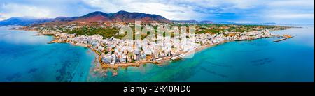 Hersonissos harbor aerial panoramic view. Hersonissos or Chersonissos is a town in the north of Crete island in Greece. Stock Photo