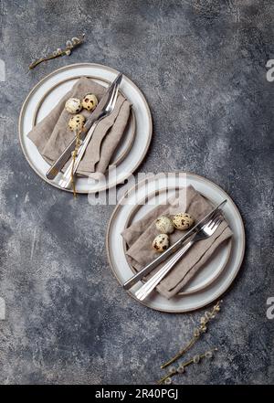 Easter festive table setting with quail eggs. top view Stock Photo