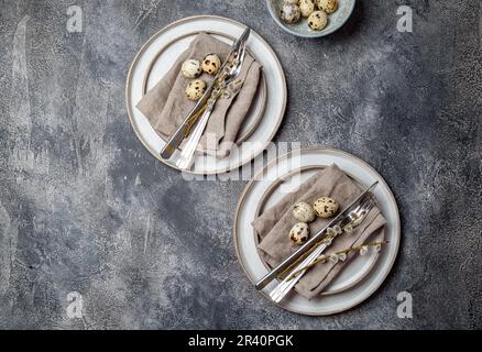Easter festive table setting with quail eggs. top view Stock Photo