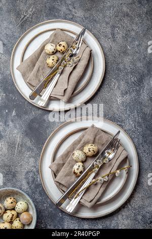 Easter festive table setting with quail eggs. top view Stock Photo
