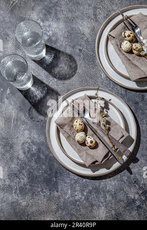 Easter festive table setting with quail eggs. top view Stock Photo