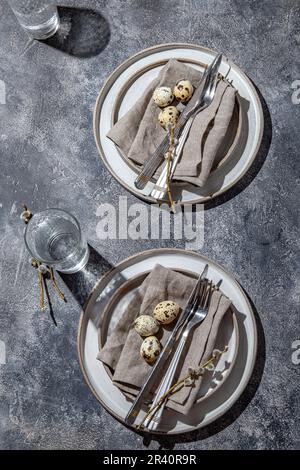 Easter festive table setting with quail eggs. top view Stock Photo