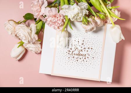Happy Valentine's Day greeting card, gift box and beautiful spring flowers on light pink background. Valentine's day, Womans day Stock Photo