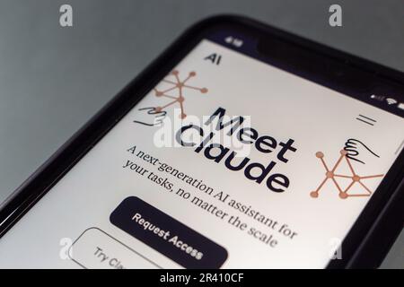 Website of Claude seen in an iPhone screen. Claude AI is a ChatGPT like next-gen AI chatbot assistant produced by AI-driven startup Anthropic. Stock Photo