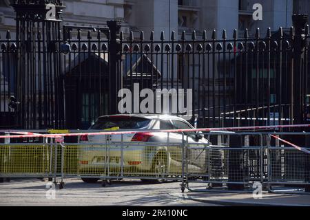 London, UK. 25th May 2023. Police set up a cordon outside Downing Street after a man crashed a car into the security gates. Stock Photo