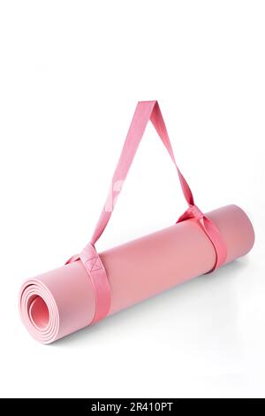 Yoga mat rolled up in roll on white background Stock Photo