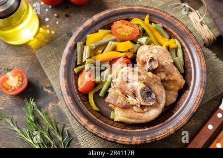 Homemade Thanksgiving dinner baked turkey and vegetables  on a dark wooden table. Stock Photo