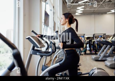 Doing cardio on the treadmill. Running on a treadmill. Stock Photo