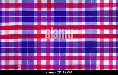 The texture of linen fabric in a large cell of red and blue. Scottish tailoring material Stock Photo