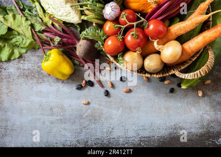 Raw organic vegetables. The concept of vegan or diet food. Vegetables for healthy cooking on a stone background. View from above Stock Photo