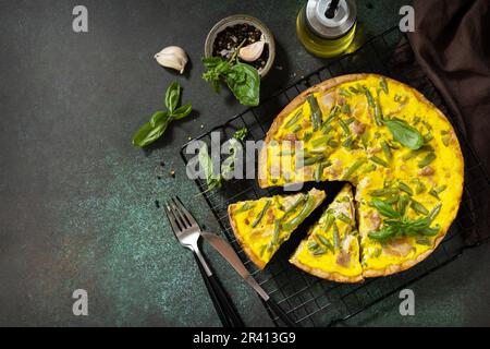 Ð¡lassic quiche Lorraine pie with tuna, green beans and soft cheese. Crustless quiche with eggs, fish and vegetables. Mediterran Stock Photo