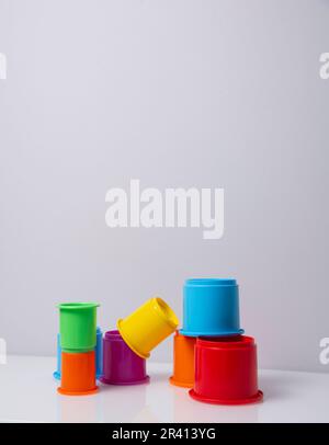 Colorful stacking plastic cups on white background.balance concept Stock Photo
