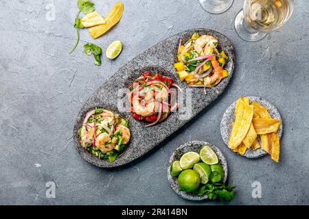 CEVICHE. Three colorful shrimps ceviche with mango, avocado and tomatoes. Latin American Mexican Peruvian Ecuadorian food. Serve Stock Photo