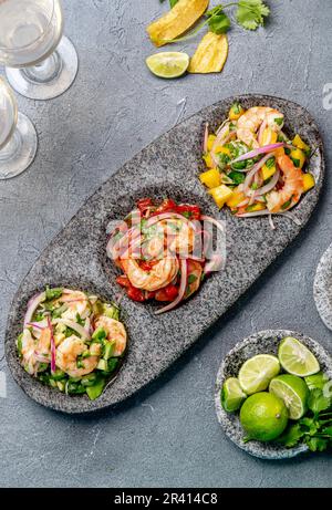 CEVICHE. Three colorful shrimps ceviche with mango, avocado and tomatoes. Latin American Mexican Peruvian Ecuadorian food. Serve Stock Photo