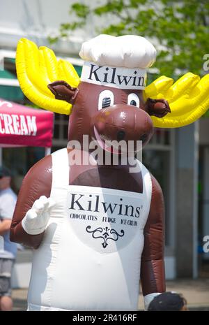 Open Streets - Hyannis, Massachusetts, USA.  A moose costumed salesman on Main Street Stock Photo