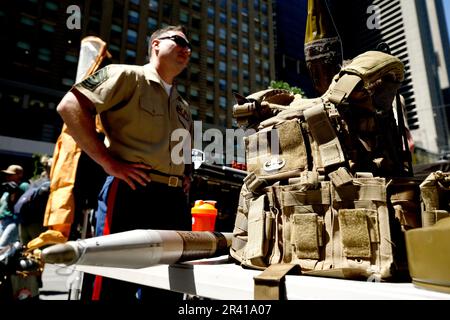 New York City, USA. 25th May, 2023. Memebers of the Chemical Biological Incident Response Force stand near their display during Fleet Week in Times Square on May 25, 2023 in New York City, USA. Each year the US Navy, Marines and the Cost Guard display their assets and engage with the public providing educational and informative details. The several day event is preceded by a Parade of Ships along the Hudson River on the West Side of Manhattan. (Photo by John Lamparski/Sipa USA) Credit: Sipa USA/Alamy Live News Stock Photo