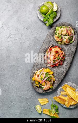 CEVICHE. Three colorful shrimps ceviche with mango, avocado and tomatoes. Latin American Mexican Peruvian Ecuadorian food. Serve Stock Photo