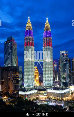 Petronas Twin Towers skyscrapers KLCC skyline in the evening portrait of Kuala Lumpur in Malaysia Stock Photo