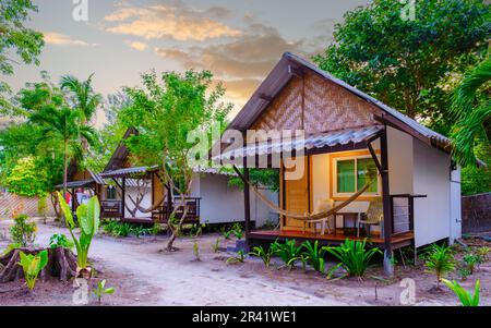 Bamboo hut bungalows on the beach in Thailand Stock Photo