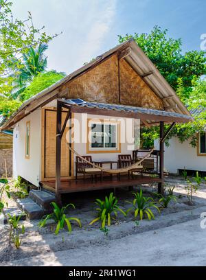 Bamboo hut bungalows on the beach in Thailand Stock Photo