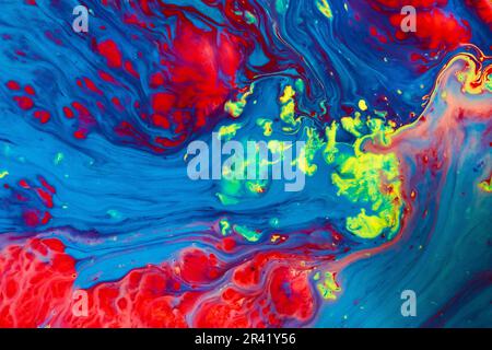 Vibrant colors clash in abstract stormy sea with phytoplankton flashes in cresting waves background Stock Photo