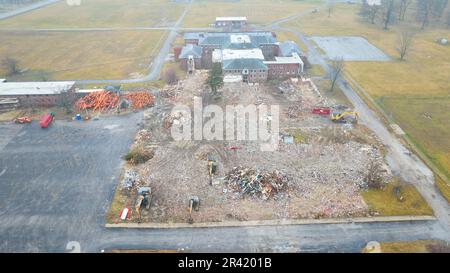 Drone aerial of large abandoned building being destroyed and demolished nearly completed Stock Photo