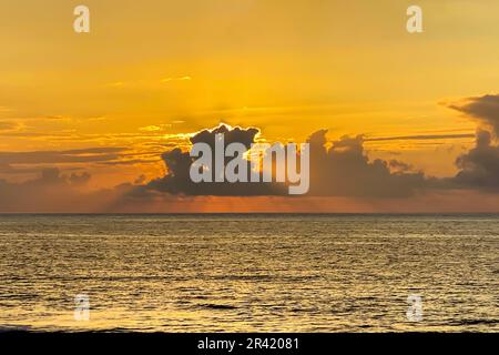 Dramatic Ocean Sunset with Golden Clouds Stock Photo