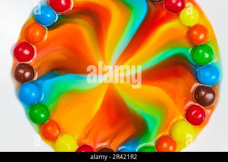 Star burst of color from candy with tie dye center Stock Photo