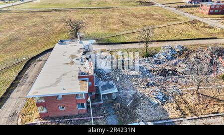 Drone aerial of large abandoned building being destroyed and demolished Stock Photo