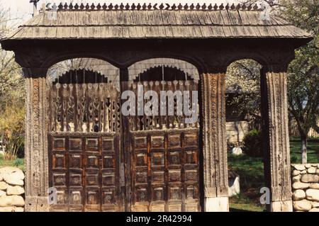 Maramures, Romania, approx. 2000. Traditional sculpted wooden gate. Stock Photo