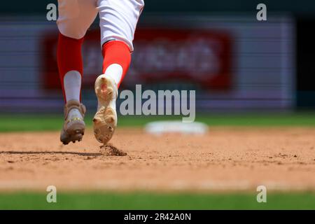 The socks and cleats worn by St. Louis Cardinals' Miles Mikolas are seen as  he throws during a baseball game against the Cincinnati Reds in Cincinnati,  Thursday, May 25, 2023. (AP Photo/Aaron