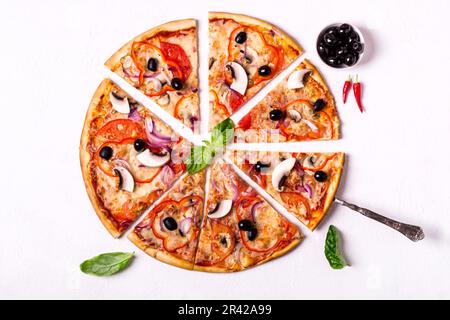 Vegetarian pizza pieces with mushrooms and olives on white background Stock Photo