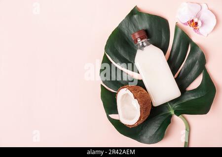 Coconut Oil or Cream, tropical leaves and flowers. Natural beauty spa product concept Stock Photo