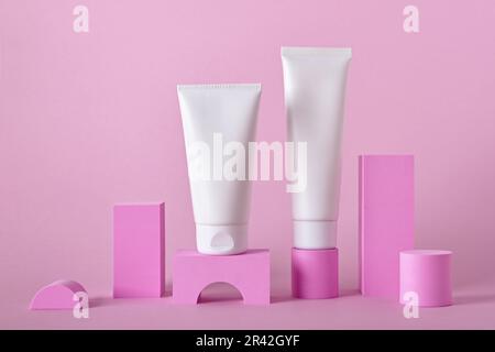 Beauty natural skincare product mock up. Cream tubes on different geometric podiums. Body Skincare products presentation Stock Photo